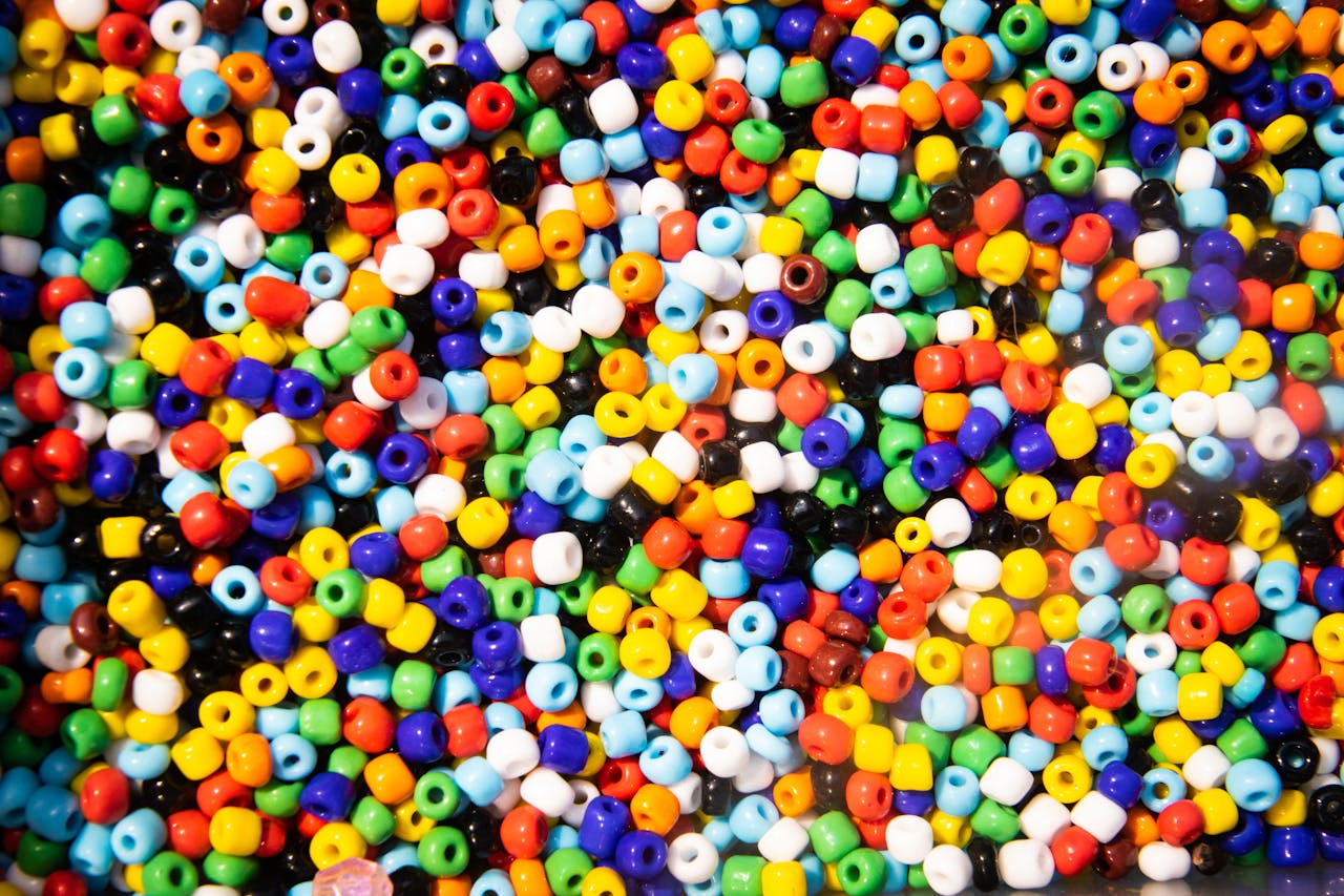 Vibrant collection of multicolored craft beads for creative projects and artistic designs.